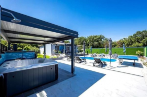 Villa with a heated pool and a jacuzzi